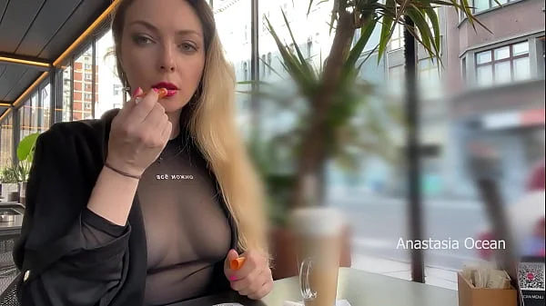 Flashing tits in cafe with glass walls so all people outside see me. Transparent t-shirt no bra.