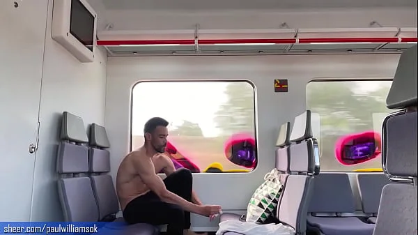 Sexy tanned man travelling naked by train. Very risky public nudity