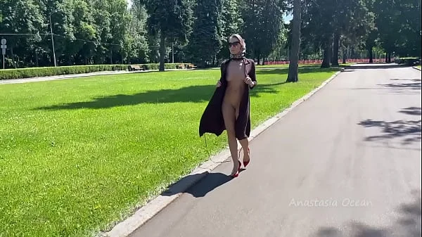 Stylish Lady walks naked in park. Public